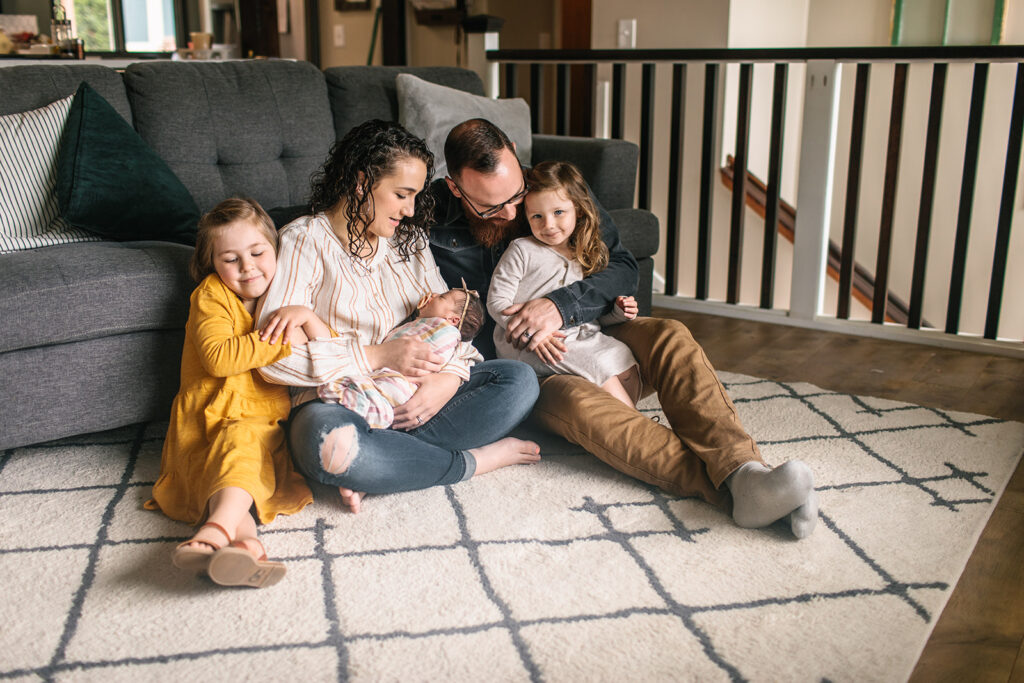 Pile the whole family on the master bed or living room floor during Lifestyle Newborn Session with Emily Louise Photography in Fort Wayne Indiana