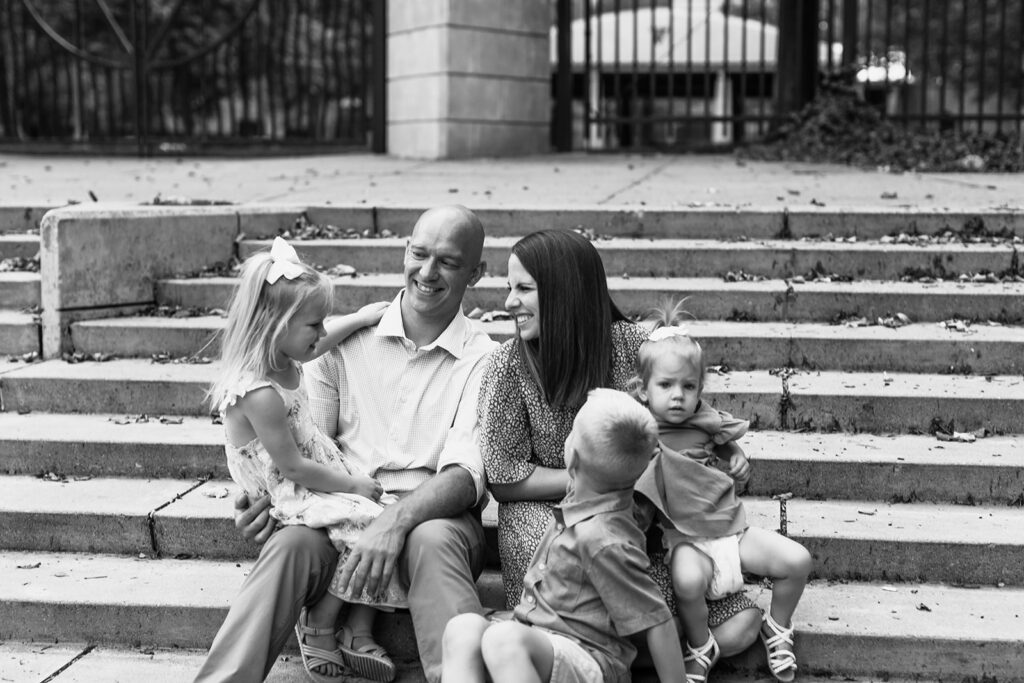 downtown family sits on the steps Fort Wayne 